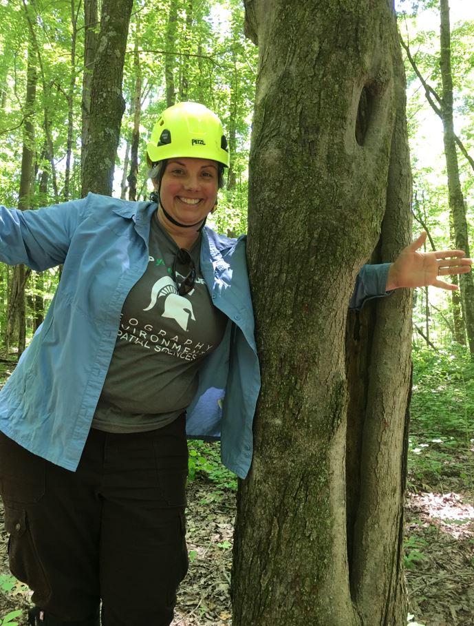 Dr. Kyla Dahlin enjoys some field work near the NEON flux tower on the property of the Oak Ridge National Laboratory in Tennessee.