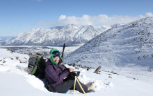 Collecting data on snow conditions in Alaska. A researcher collects data on snowpack properties in Alaska.